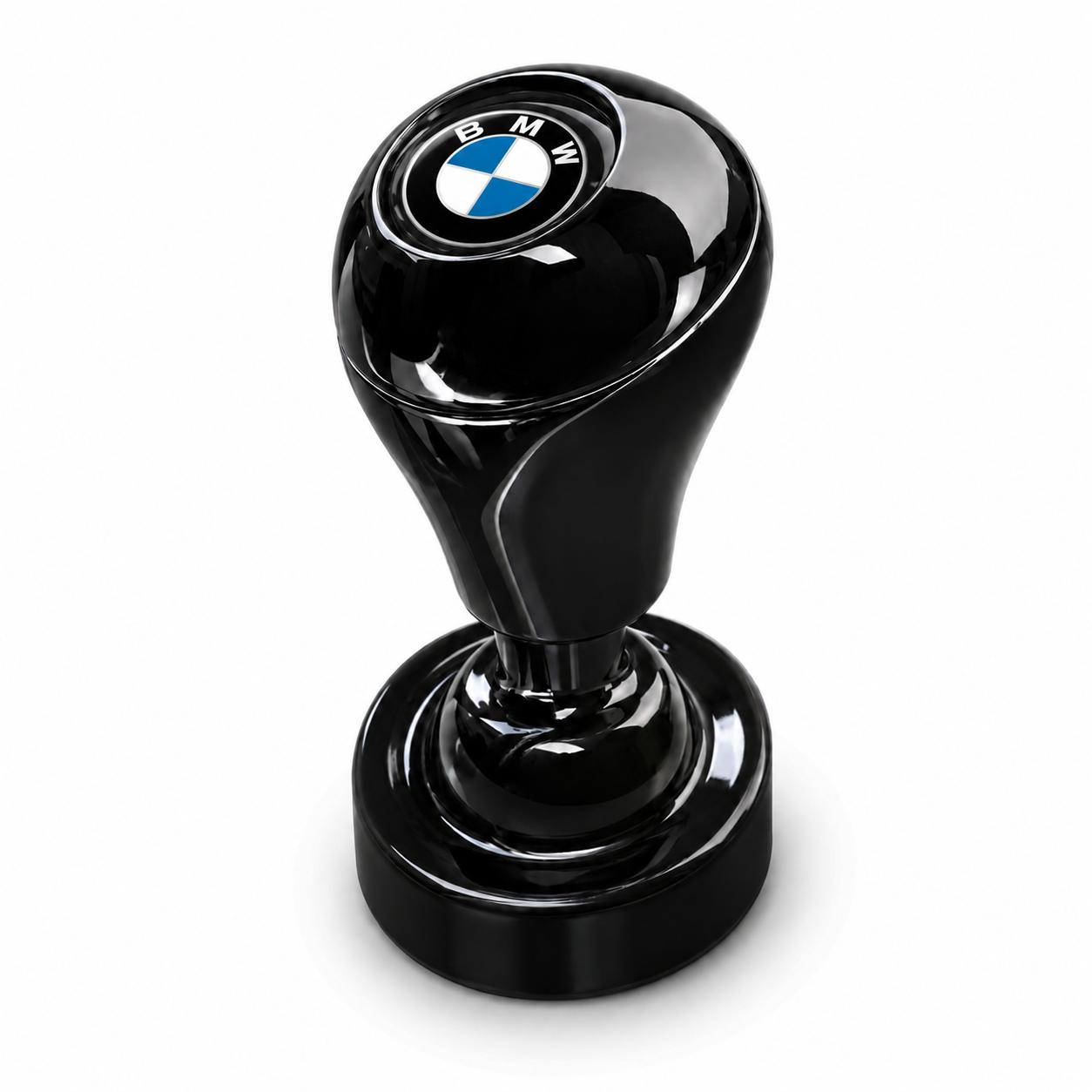 A sleek black Car Start / Stop Button Joystick with a shiny finish and BMW logo stands upright on a white background—ideal for car enthusiasts and fans of premium interior accessories.