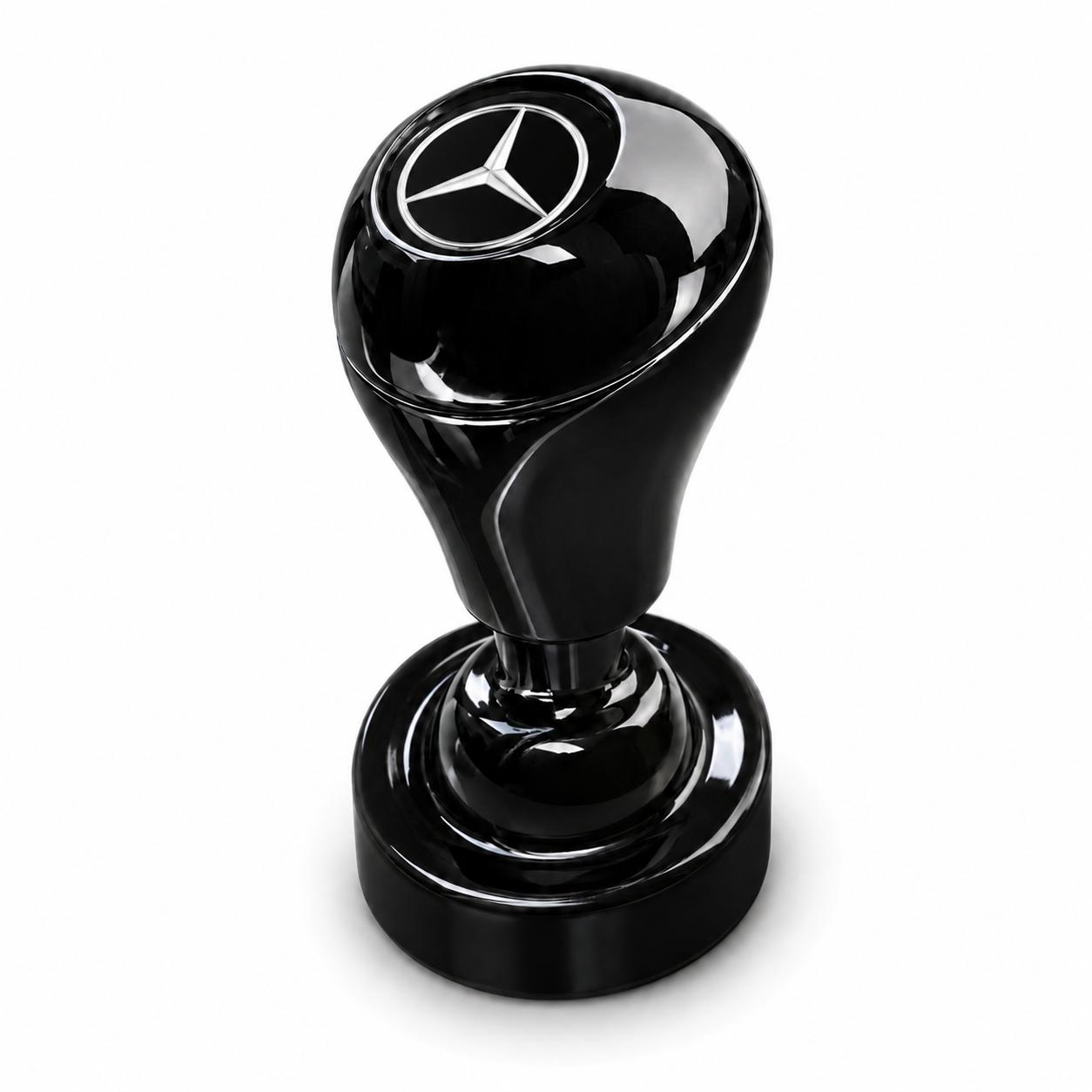 The Car Start/Stop Button Joystick is a black, glossy accessory with a round base and a handle displaying the Mercedes-Benz logo on top, adding style to your car’s interior. Shown against a white background.